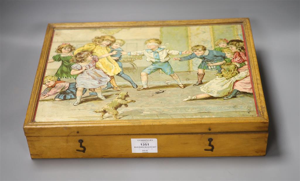 A Victorian chromo-lithographed building block set in original case.